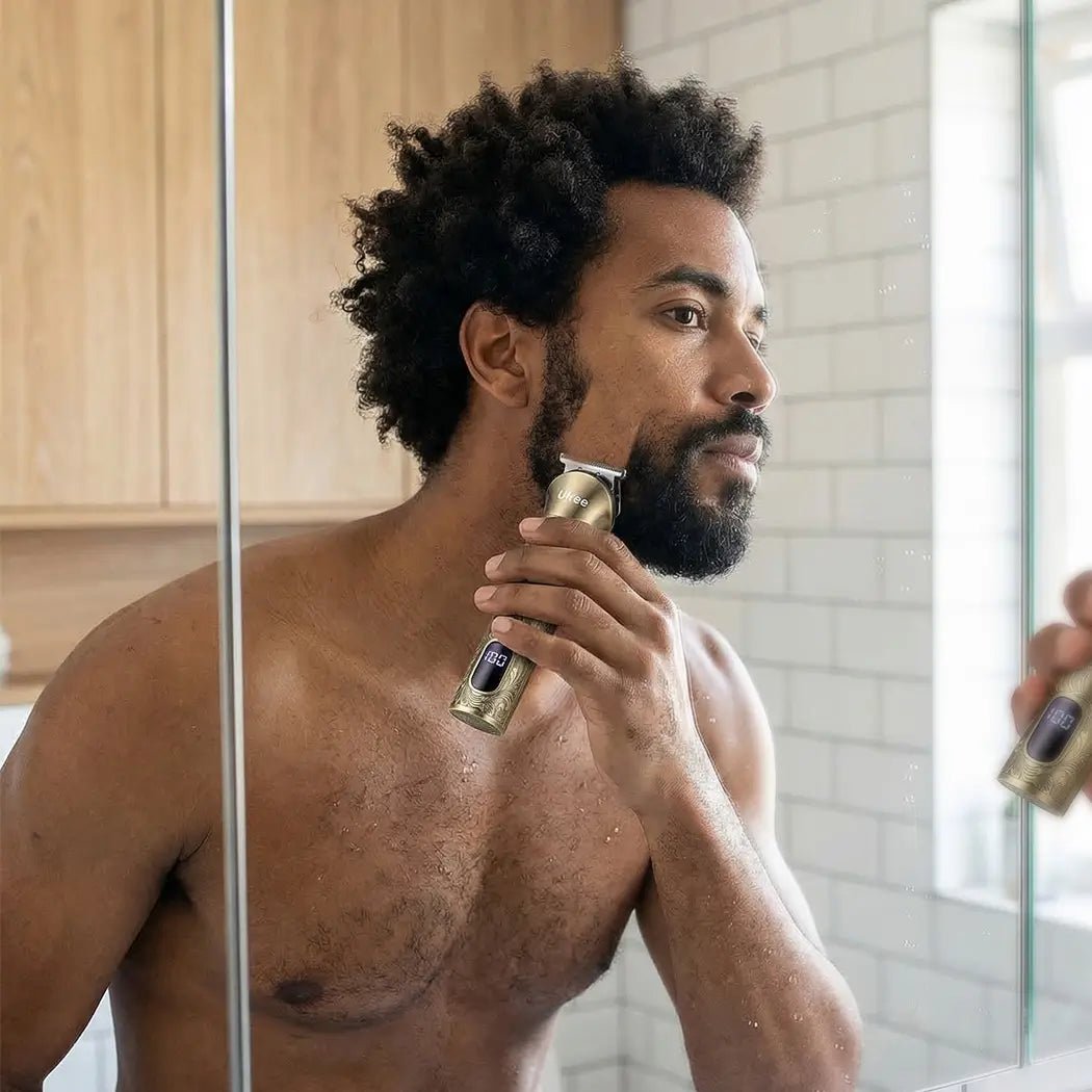 A modern man is shaving his beard with a beard trimmer